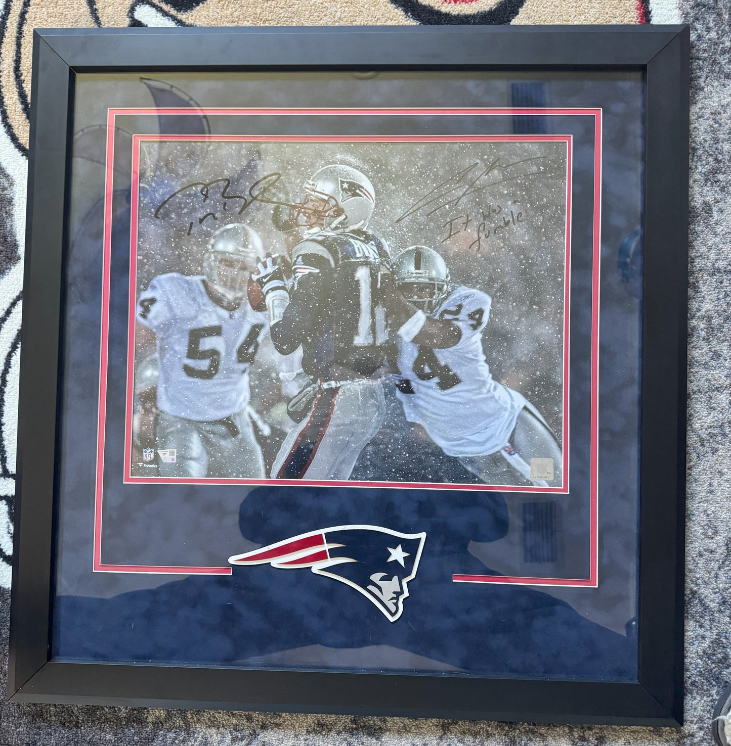 Tom Brady & Charles Woodson Signed New England Patriots (Tuck Game) 16 x 20 FRAMED Photograph🖼️ with "It was a Fumble" inscription. Also includes Fanatics COA 🛡️