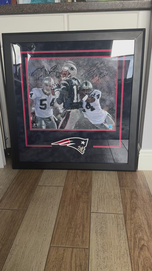 Tom Brady & Charles Woodson Signed New England Patriots (Tuck Game) 16 x 20 FRAMED Photograph🖼️ with "It was a Fumble" inscription. Also includes Fanatics COA 🛡️